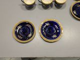 four cups and two saucers on the table