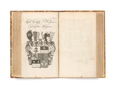 an open book with a coat of arms and a coat of arms on it