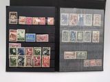 a black folder with a lot of stamps on it