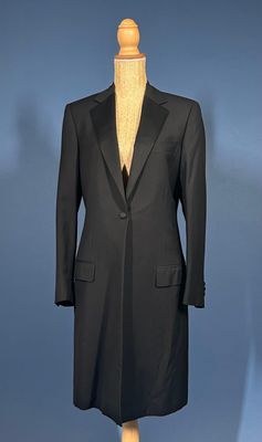 an image of a black suit on a mannequin stand