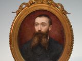 portrait d'un homme barbu dans un cadre en or