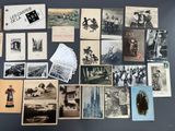 many old photographs of people on display on the wall