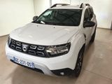 the front view of a white dacia parked in a garage