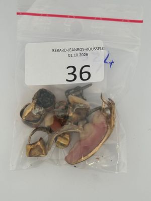 a bag of brass bells in it on a table