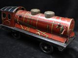 a toy train that is sitting on a black surface