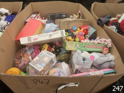 a cardboard box full of toys and toys for sale