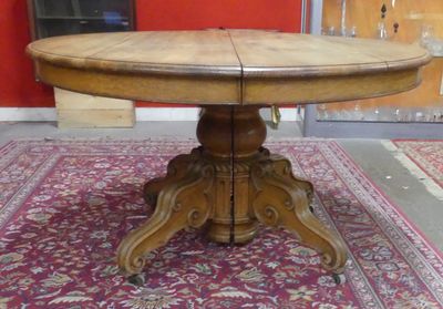 a wooden table with a wooden top on a rug