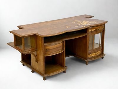 a wooden desk with a glass cabinet on top of it
