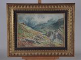 une peinture à l'huile représentant un paysage de montagne, posée sur un chevalet en bois