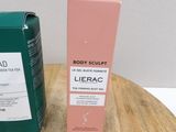 a bottle of body sculpt next to a tube of lierac