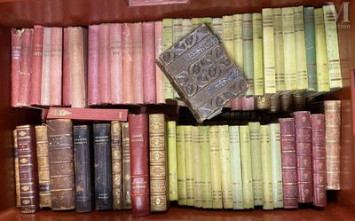 many old books in a wooden box on the shelf