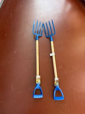 two forks that are sitting on a table