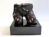 a sculpture of a boot that is sitting on top of a box