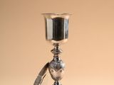 silver plated chalicet on a beige background