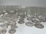 a lot of empty wine glasses sitting on a table