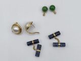 two pairs of earrings and a pair of earrings with a pearl