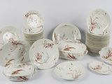 a lot of plates and bowls that are sitting on a table