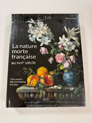 a book with a picture of flowers and fruit on it