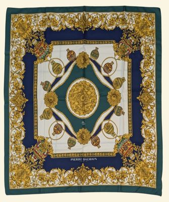 a blue and gold square scarf with a medallion design