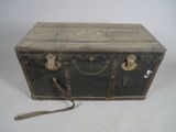 an old trunk that is sitting on a white surface