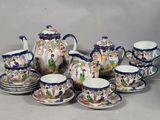 a group of tea and coffee cups and saucers