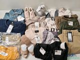 a lot of clothes that are sitting on a table