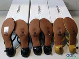 four pairs of women ' s shoes are lined up in a row
