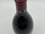 a bottle of wine that is sitting on a table