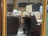a mirror that is sitting on a table in a room