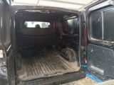 a black van with a flat bed in the back of it