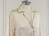 an image of a woman ' s shirt on a mannequin