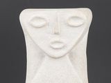 an image of a white ceramic sculpture of a woman ' s face