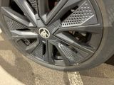 a close up view of a car ' s wheel on display