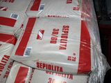 a pile of bags of flour sitting on top of a table