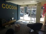 a living room with a couch and a chair in it