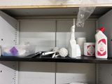 a shelf that has a lot of cleaning supplies on it