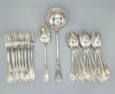 a lot of silver spoons and spoons on the table