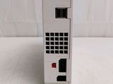 a white vending machine sitting on a white surface