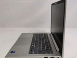 an open laptop computer sitting on top of a white table