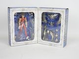two boxes with action figures inside of them on a white surface