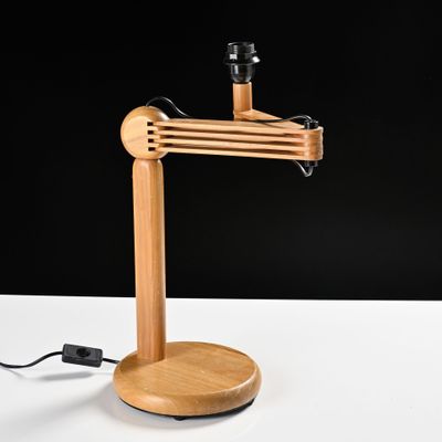 a wooden lamp that is on top of a table