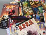 a lot of comic books that are on the table