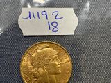 a close up of a gold coin in a plastic bag