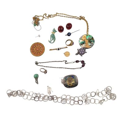 a lot of jewelry that is laying out on the table