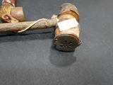 a wooden stick with a stick handle and a stick handle
