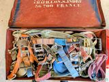 a box full of assorted belts and other items