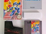 a nintendo game and a gameboy on a table