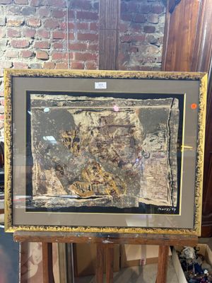 a picture of a painting on a easel in a room