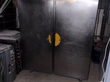 two refrigerators that are in a kitchen next to each other