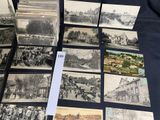 several old black and white photographs of people and buildings on a table